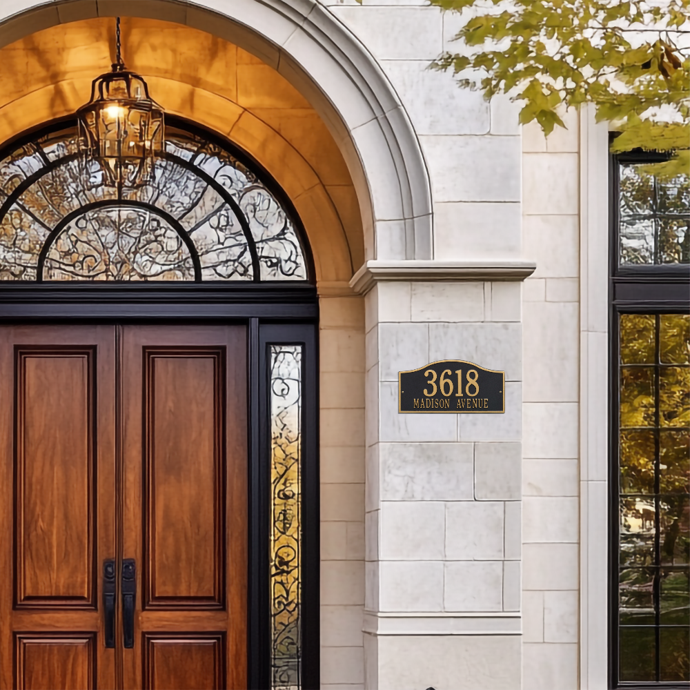 Whitewall plaque against cotemporary house 